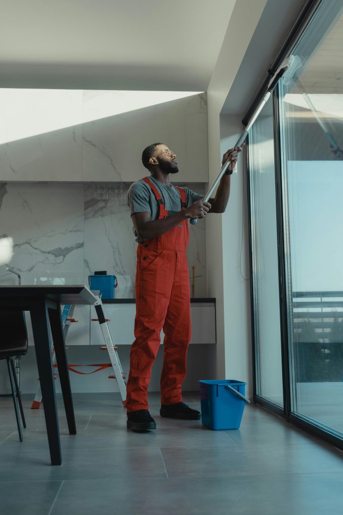 zipwp-image-6197122 Man Cleaning the Windows